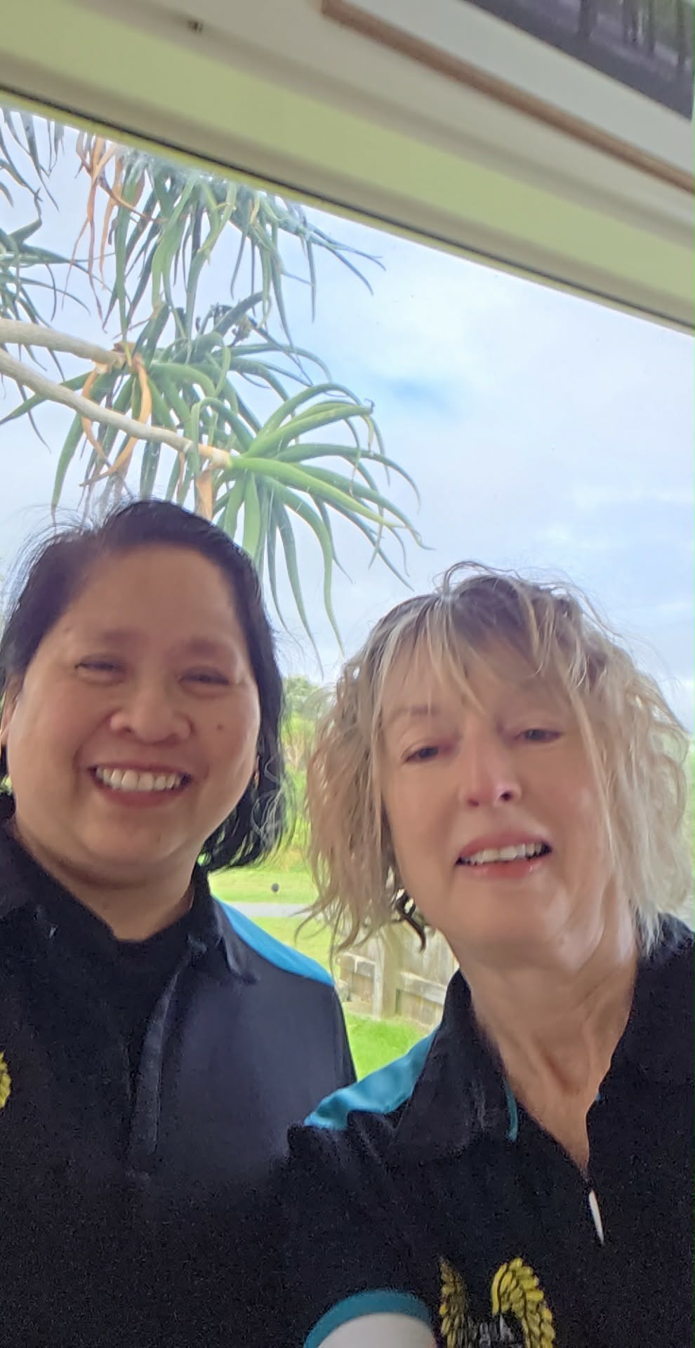 Two women smiling together at home